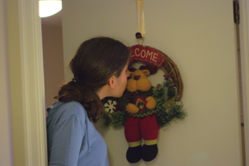 Here I am with our Christmas Wreath.  it's inside, because nobody but us ever see's our "front" door anyways